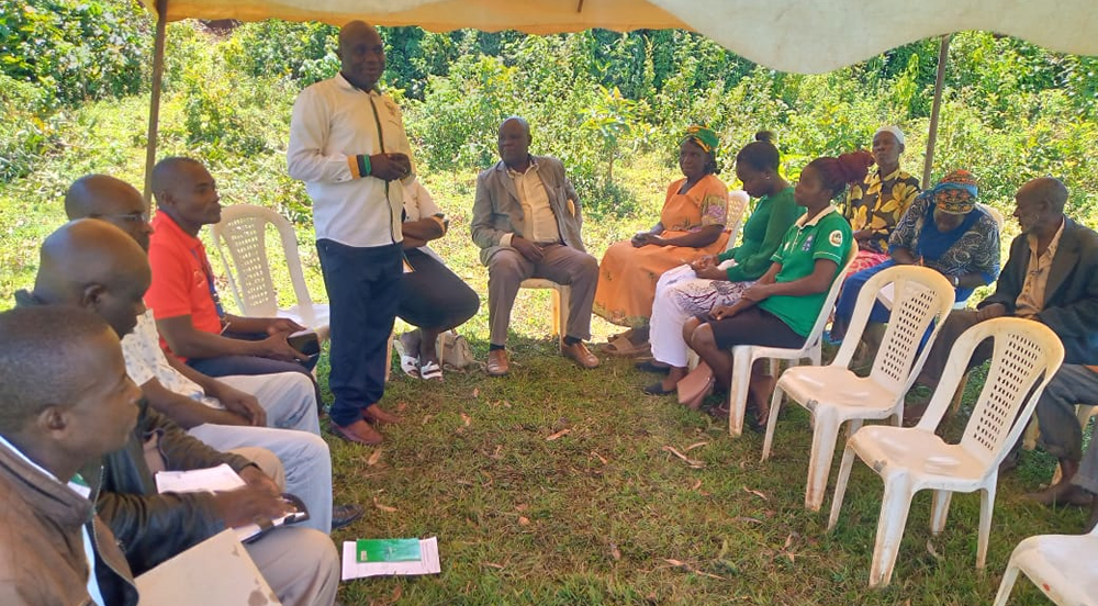 EYCBO members during signing of voluntary wetland protection and conservation agreement with farmers whose land boarder river Firatsi in Butere sub-county, of Kakamega county.